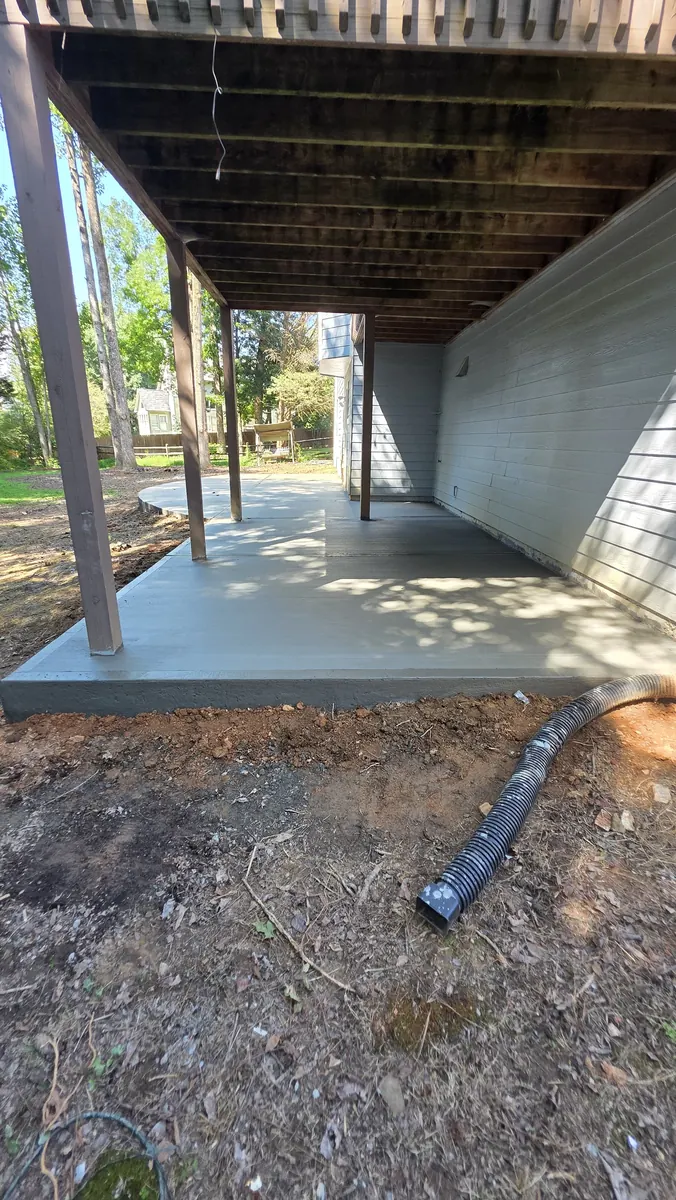 Under-deck residential concrete patio in Lawrenceville GA